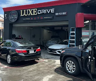 Luxe Drive Auto storefront and service bay on Flatbush Ave in Brooklyn, NY